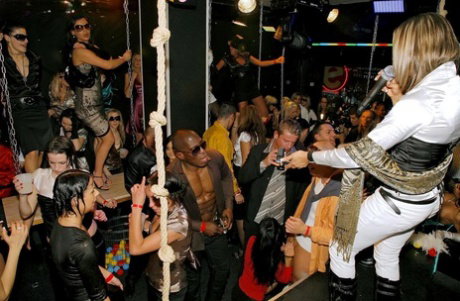 Drunk chicks douse themselves in champagne before sucking cock in nightclub