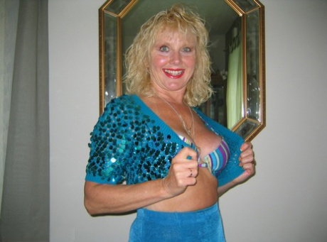 Aged amateur with curly blonde hair exposes herself during lingerie changes