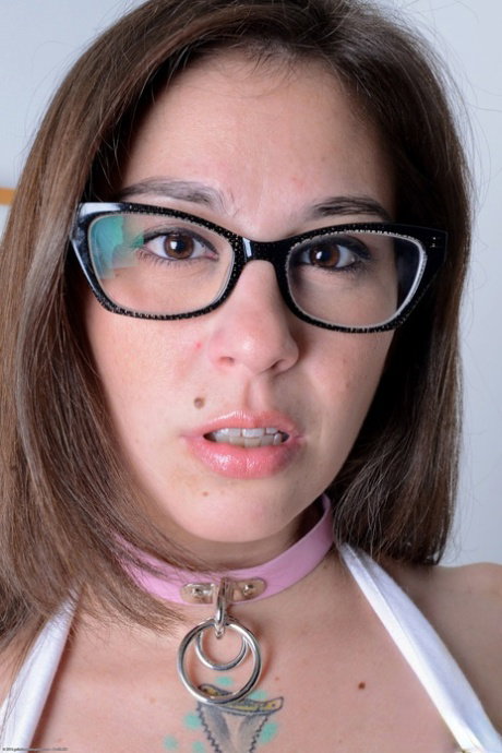 Glasses clad girl Kacie Castle finger spreads her tight pussy and asshole too