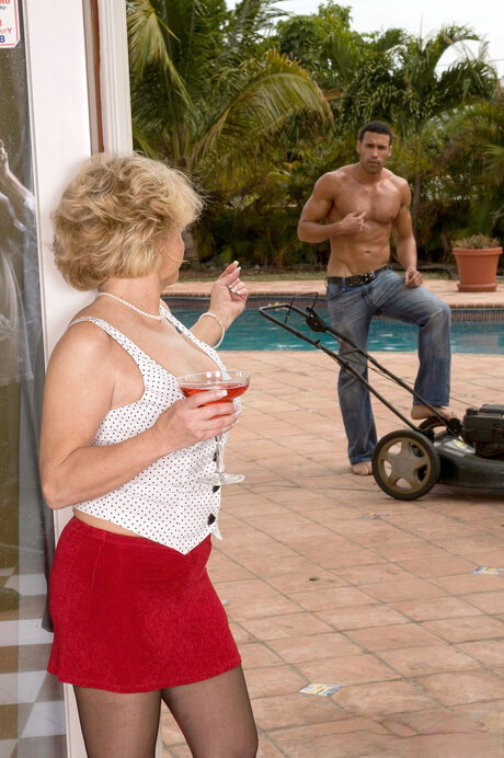 Busty blonde granny DeAnna Bentley takes a cumshot on her sore asshole