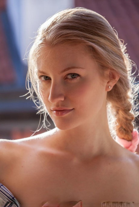 Flexible blonde teen Bretona shows her nice ass and shaved pussy in the nude