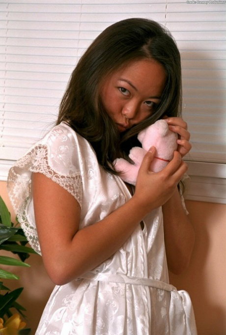 Petite Asian amateur Amy revealing tiny tits and shaved vagina in bare feet