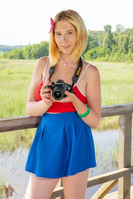 Nice teen Alana gets totally naked on a boardwalk at a marsh