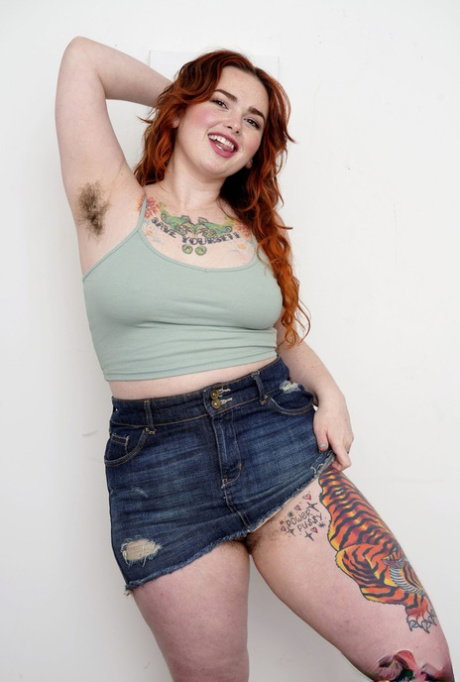 Tattooed fatty Adora Bell flaunts her big ass and spreads her hairy pussy