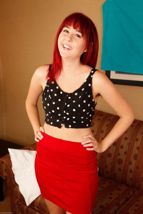 Redheaded amateur shows her natural tits before playing with her full bush
