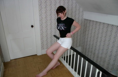Teen amateur B4rbi3 lifts up her T-shirt to expose her firm breasts