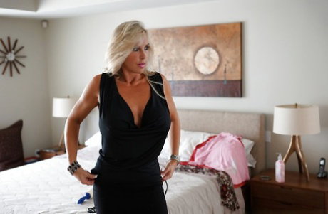 Mature housewife Sandra Otterson takes part in a sexy posing scene