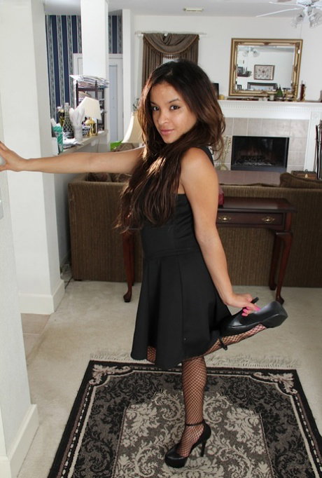 Brunette milf Viviann Wood is taking off her sexy black dress