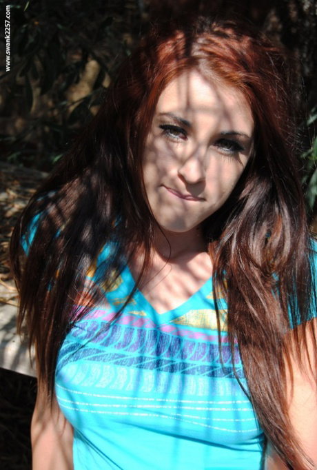 Sweet redheaded MILF Michelle Thorne unveils her lovely natural tits outdoors
