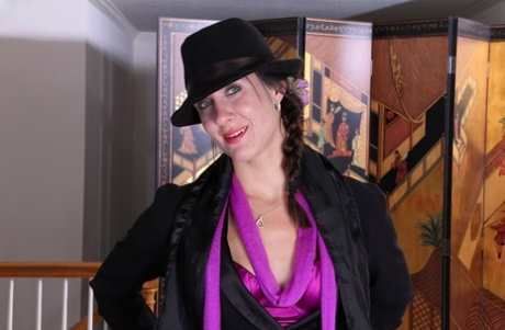 Frisky MILF getting nude and demonstrating her pierced slit