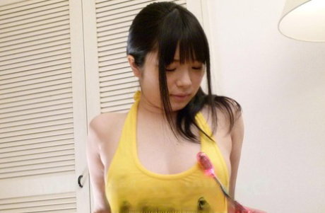 Japanese girl Hina Maeda is masturbated with a few vibrators by a guy