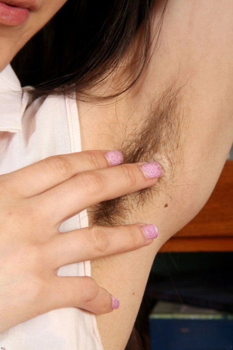 Brunette amateur Annie reveals her hairy armpits and twat in a solo