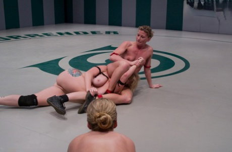 Naked females wrestle each other during an ultimate surrender match