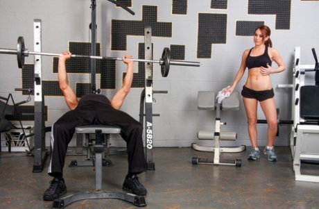 Fit female Amber Ashley takes a cumshot on titsafter sex in a gym