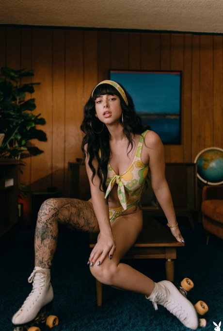 Glamorous raven-haired babe Reed poses naked on her roller skates