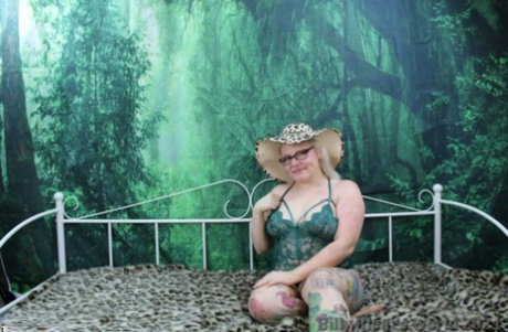 Tattooed British woman with blonde hair Mollie Foxxx masturbates with a dildo