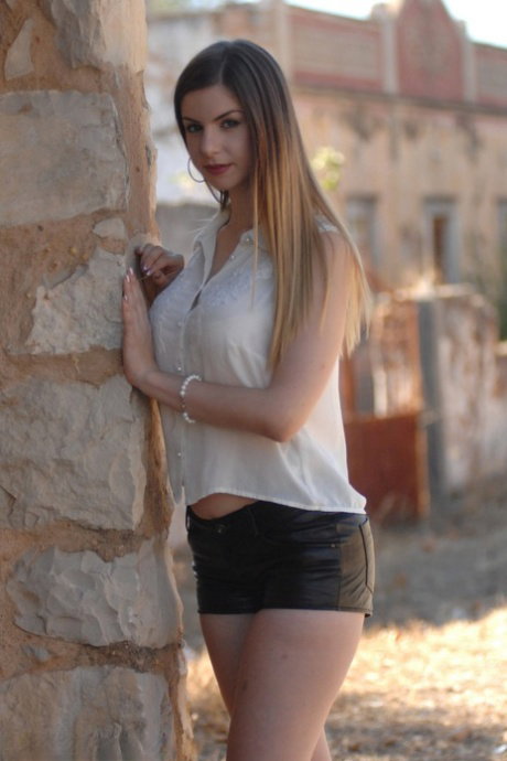 Beautiful girl Stella Cox slowly takes off her clothes to go naked outdoors