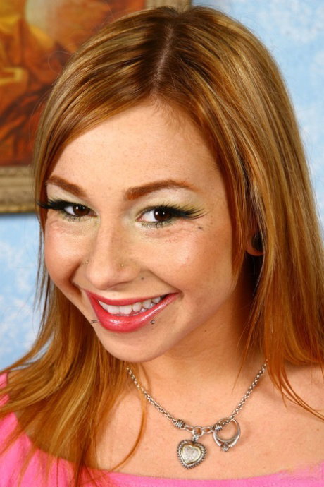 Tattooed redhead Scarlett Pain strips naked prior to a POV handjob