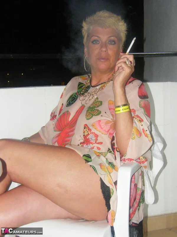 Middle-aged blonde Dimonty smokes while getting completely naked  - Amateur, Smoking, Saggy Tits, Short Hair, Chubby, MILF, Curvy, Thick, BBW, Blonde  - Photo 1
